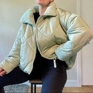 Large mint green diamond puffer jacket.